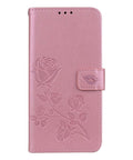 Pink leather phone case with embossed rose design and magnetic clasp.
