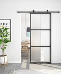 40 Inch By 96 Inch Frosted Glass Barn Door With Top Mounted Hardware Kit installed in living room entryway.