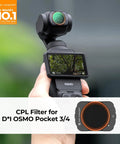 Person holding DJI Osmo Pocket 4/3 with attached Osmo Pocket 4x3 Magnetic CPL Filter, displaying clear sky reflection.