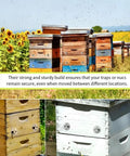 Beehives in field with 4-Pack Stainless Steel Bee Hive Entrance Discs, 4.92 Inch Diameter, Easy Install Entrance Reducers visible