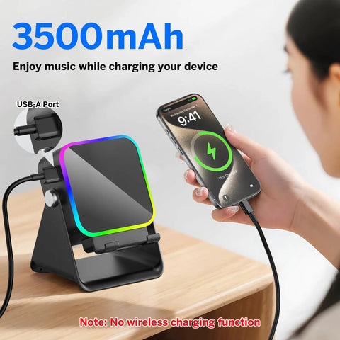 Induction Wireless Speaker With Phone Stand Five In One Bluetooth Speaker showing USB charging and RGB lights on table