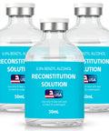 Three 50 mL clear glass reconstitution solution vials with blue labels, 0.9% benzyl alcohol, Made in USA.