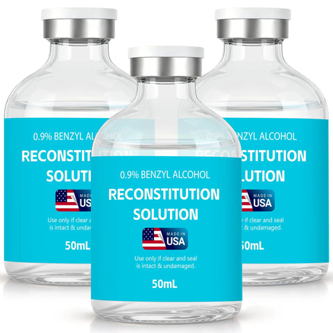 Three 50 mL clear glass reconstitution solution vials with blue labels, 0.9% benzyl alcohol, Made in USA.