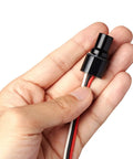 Hand holding Compact LED Dimmer Knob With Rotary Control For 12-24V LEDs, waterproof PWM dimming, built for cars and boats.