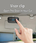 Two Pack Universal Garage Door Opener Remote SM24 MAX For Sears Craftsman LiftMaster on car visor with hand pressing button