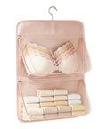 Pink Mesh Storage Hanging Bag With 360 Swivel Hook and Expandable Double Layer Closet Organizer storing bras and folded underwear.