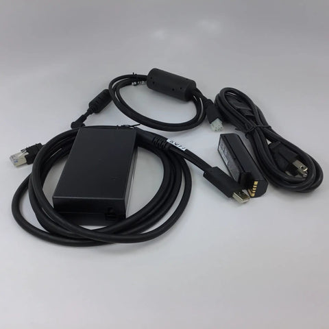 Hardcore Rugged Cordless Barcode Scanner Kit Built For The Grind With Direct Part Marking And Bluetooth 2D 1D Imager Includes Charging Cradle Dual Vibration Alerts And Power Supply cables and power supply components on a white background.