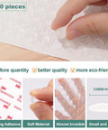 100 Pieces Clear Self Adhesive Cabinet Door Bumpers 0.4 Inch Diameter Rubber Dots displayed with hand and adhesive details