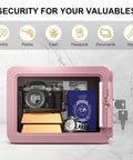 Pink home safe box for kids and money, compact lock box with key, storing valuables and documents, open view, marble background