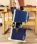 Person holding Beast Of A Portable Nine Inch Woodworking Bandsaw With Cast Aluminum Worktable And Scale, showing compact design.