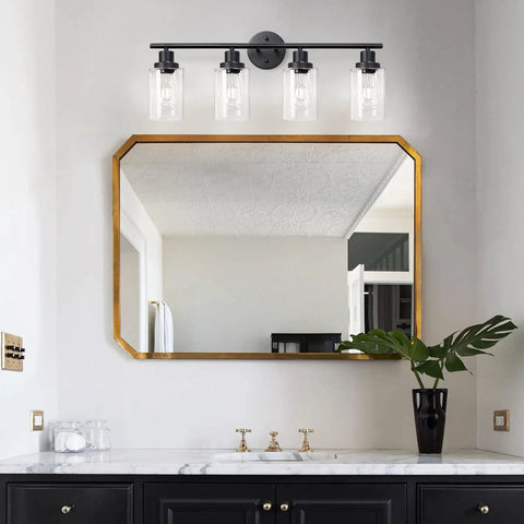 4 Light Vanity Lights Black Wall Sconce With Clear Glass Over Mirror in modern bathroom setting above mirror