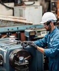 Worker using machinery with Copper Anti Seize Thread Lubricant Paste For Cars Pro Grade Auto Maintenance Grease nearby