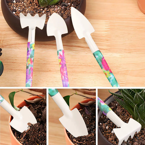 Ten Piece All In One Garden Tool Kit With Floral Print And Ergonomic Handles Including Trowel Rake Weeder Pruner Shears Sprayer And Hedge Shears In A Hard Shell Carrying Case Awesome Gift For Women And Dads, close-up of trowels and rake in floral pattern