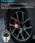 Close-up of Volkswagen Wheel Lock Key And Lug Nut Key Tool for VW Cars next to vehicle wheel.