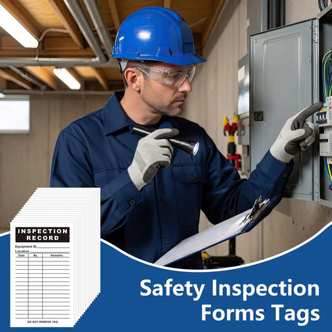Worker inspecting control panel with clipboard and stack of 500 Pack Inspection Record Labels for Safety Inspections.