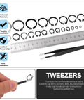 Image showing a 266 Piece 21 Sizes C Clip External Retaining Rings Set With Tweezer 65Mn Steel Snap Ring Kit For Axles Shafts And Moving Parts Pro Grade Heavy Duty Circlip Assortment For Shop And Automotive, including various sized rings, a ruler, and tweezers.