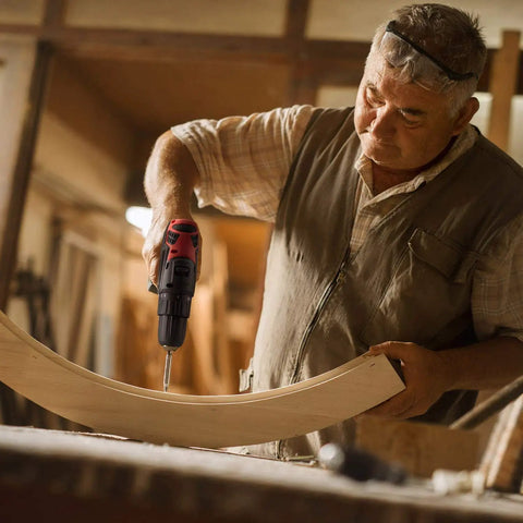Man using G12 Series 12 Volt Cordless Drill Driver With 265 Inch Pounds Torque on wood curve, tool only for DIY and home repairs