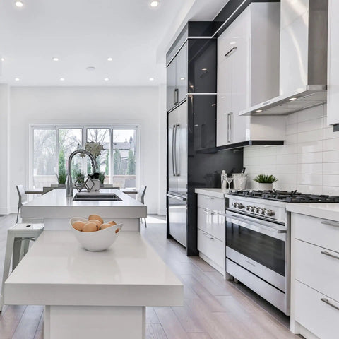 Modern kitchen with stainless steel appliances and white cabinets featuring Champagne Oval Flat Cabinet Handles Set In Stainless Steel For Kitchen Cabinets And Dressers, 6-3/10 Inch Center To Center, 170mm Total Length, 20mm Width, Hollow Yet Solid Drawer Pulls Top Notch Cupboard Hardware.
