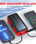 63200mAh Solar Power Bank With Dual Outputs And Inputs Hand Crank Emergency Charger charging two devices simultaneously