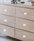 12 Pcs Matte Single Hole Cylindrical Cabinet Door Handles, Drawer Pulls For Kitchen Cabinets on a wooden dresser drawer
