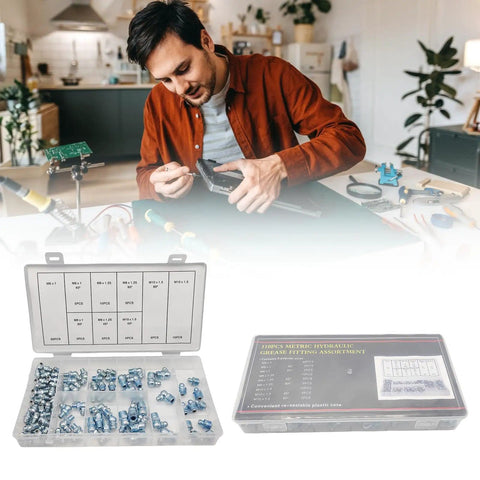 Man assembling with 110 Piece Metric Grease Fittings Kit with box of straight, 45°, and 90° zerk nipples for machinery lubrication.