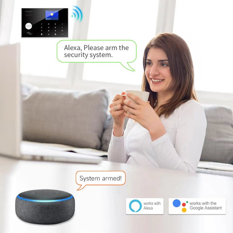 DIY WiFi Home Security Alarm System Kit With 12 Piece Bundle Including Motion Detectors, Door Sensors, Remote, Siren And App Alerts, Alexa And Google Compatible, No Monthly Fee, Works With Smart Life App, Ideal For Home Villa And Family Safety. Woman arming system with Alexa