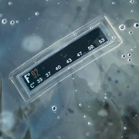 Close-up image of temperature gauge on 2.5 Gallon Solar Shower For Outdoor Camping And RV Use Four Layer Heat Retention System