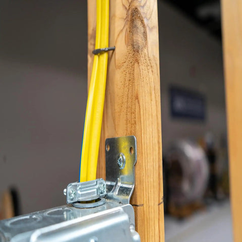 SIMpull Solid Indoor 14/3 W/G NM-B Copper Building Wire 100 Ft Coil installed in a residential framing with easy pull jacket