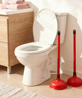 Tough As Nails Toilet Plungers 12 Pack Bulk 19 Inch Long Handle Suction Cup Plunger Built To Crush Stubborn Clogs Fast With Heavy Duty Rubber Cups And Slip Resistant Grips For Households Or Properties In Bold Red beside a clean toilet.