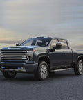 Blue Front Tow Hook Covers Set Of 2 For 2007 To 2024 Chevy Silverado 1500 on truck in scenic landscape