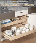 Installed kitchen cabinet tray showing 16 inch side mount soft close drawer slides with dishes and utensils, note on bracket use