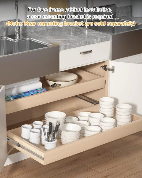 Installed kitchen cabinet tray showing 16 inch side mount soft close drawer slides with dishes and utensils, note on bracket use