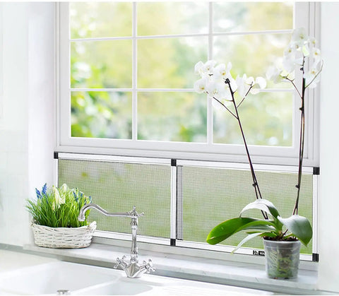 Expandable Window Screen 2-Pack With Frame, Adjustable Fit for Double Hung Windows installed in kitchen window with plants