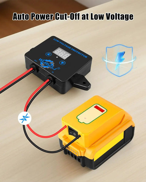 Beefed-Up 12V To 36V DC Low Voltage Protection Module With Display, shown with battery, on a wooden surface.