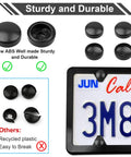 Close-up of Black Anti Theft License Plate Screw Kit with caps, stainless steel construction on mounted license plate frame