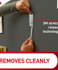 Applying a Slap On Universal Picture Frame Hangers Deliver Dead Easy Damage Free Wall Mounting Renter Approved Metal Adhesive Straps.