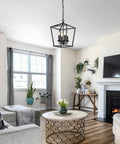Go-To Industrial Black Four-Light Pendant With Candle-Style Cage Chandelier in modern living room setting
