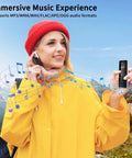 Person in a yellow jacket using 96GB MP3 Player With Bluetooth Five Point Two On The Go Portable Music Player.