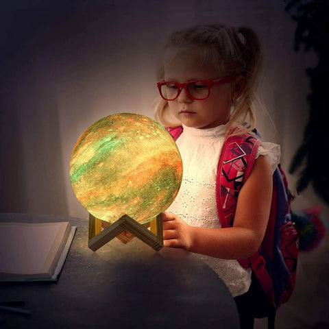 Child admiring the 7.0 Inch Moon Lamp Night Light with 16 Color LED, 3D Printed Moon Surface, on wooden stand.