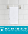 Satin Nickel Hand Towel Bar With 4 Water Resistant Strips, 9 Inch Holder mounted on bathroom tile with a towel.