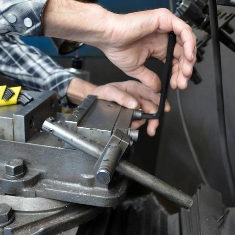 Person using Ball End L-Wrench Set Of 13 Balldriver Tools With Sizes From.050 To Three Eighths Inch in machinery assembly