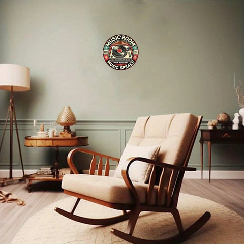 Round aluminum wall sign featuring retro music room turntable design, 8in, mounted on a green wall.