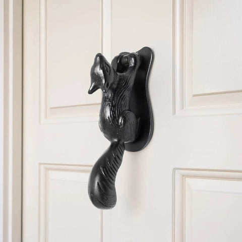 Black Cast Iron Squirrel Shaped Door Knocker With Mounting Hardware on white door, 6.75 inch front door accessory, weatherproof finish