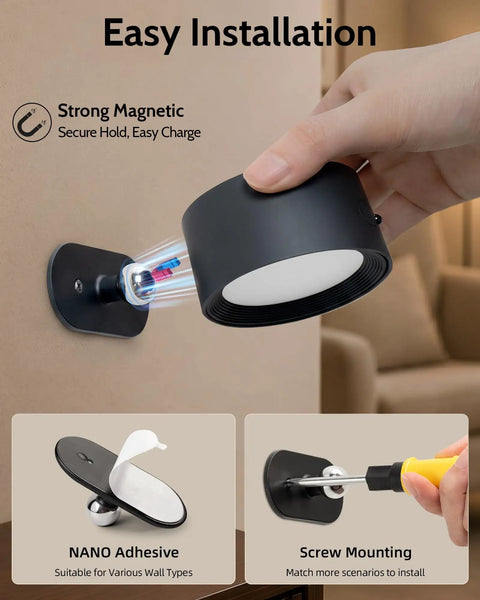 Close-up of hand installing Cordless Rechargeable Wall Sconces With Remote, Magnetic Led Bedside Lamp In Sleek Black using strong magnets.