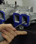 Close-up of Sworker 5-piece long carbide burr set with 1/4 in shank, 4.3 in length, for grinding metal in tight engine areas