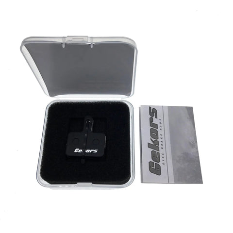 Quiet Semi-Metallic Bike Brake Pads For MTB And E-Bike in open case with manual, compatible with Shimano Deore MT200 and Tektro brakes
