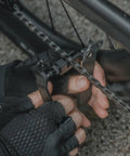 Person using Five In One Bike Tool with Chain Tool and Master Link Pliers for on-the-go bike maintenance