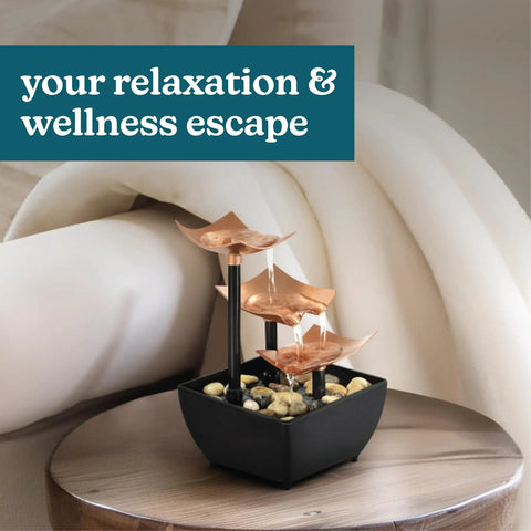 Tabletop Water Fountain With Three Tiers For Indoor Zen Waterfall Vibe on round table, natural river rocks, home decor.