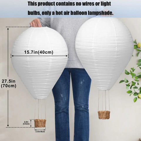 Person holding two 16 Inch Handmade Hot Air Balloon Lantern Lampshades without wires or bulbs, illustrating size and detail.