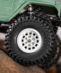 1.0 Inch Maverix MT Tires 57x22mm for 1/18 and 1/24 RC Crawlers on toy car on rock surface